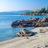 A sandy coastline with large stones